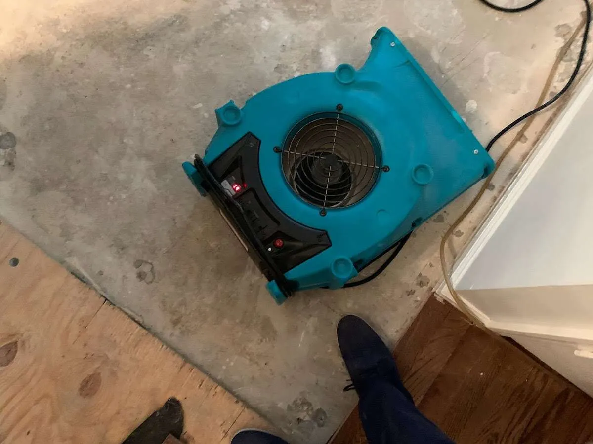 Air mover drying subfloor during Leak Detection & Repair in Pequea